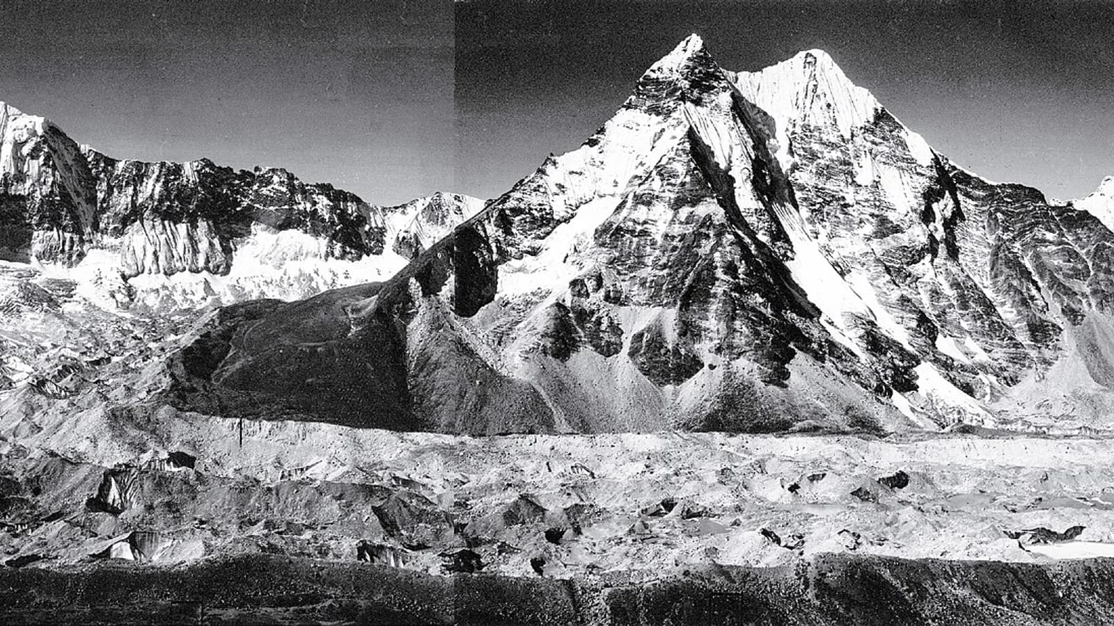 Snow-capped Himalayan peaks rising above a high-altitude valley in Nepal