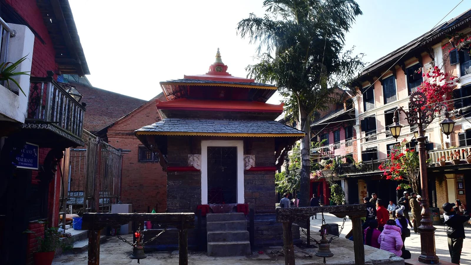 A red-and-white Newari pagoda temple in the main square of the hilltop town of Bandipur