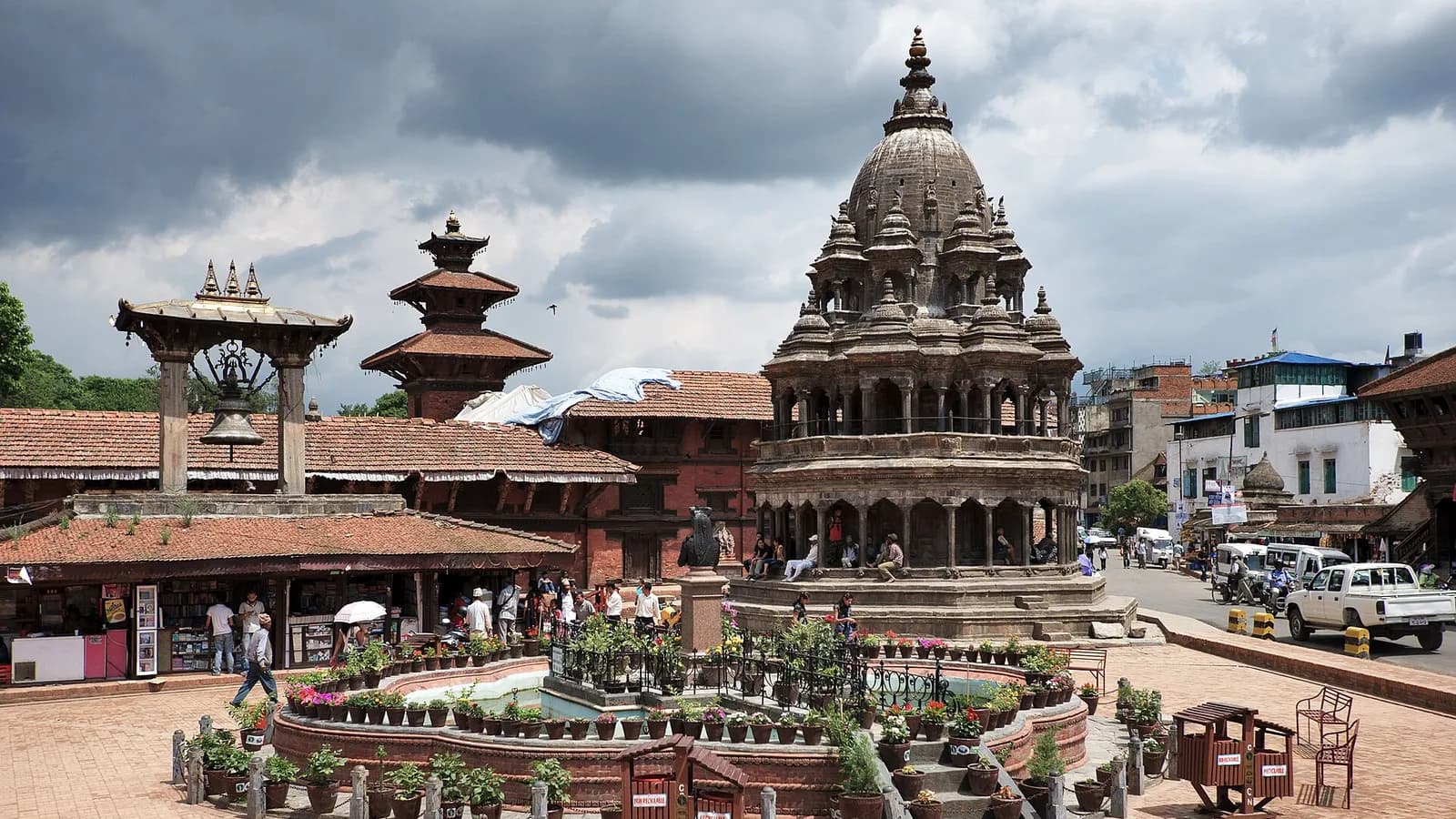 Patan Durbar Square in the Kathmandu Valley, with tiered Newari temples and stone-paved courtyard