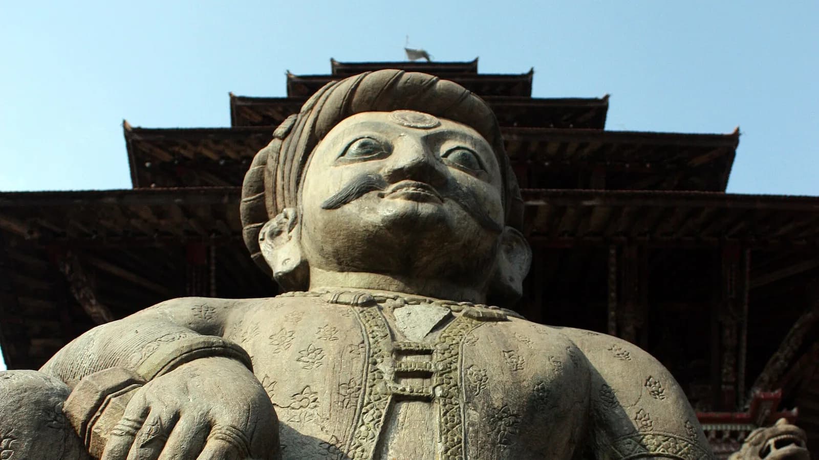 Stone guardian statue at the base of the multi-tiered Nyatapola Temple in Bhaktapur Durbar Square, near where Bisket Jatra unfolds.