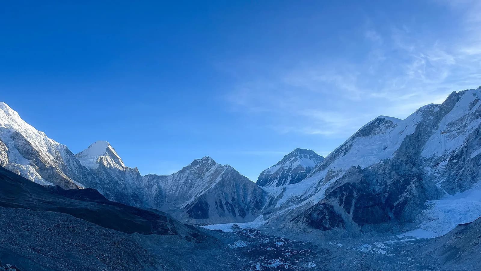 Trekkers crossing the Khumbu Glacier moraine on the final stretch to Everest Base Camp