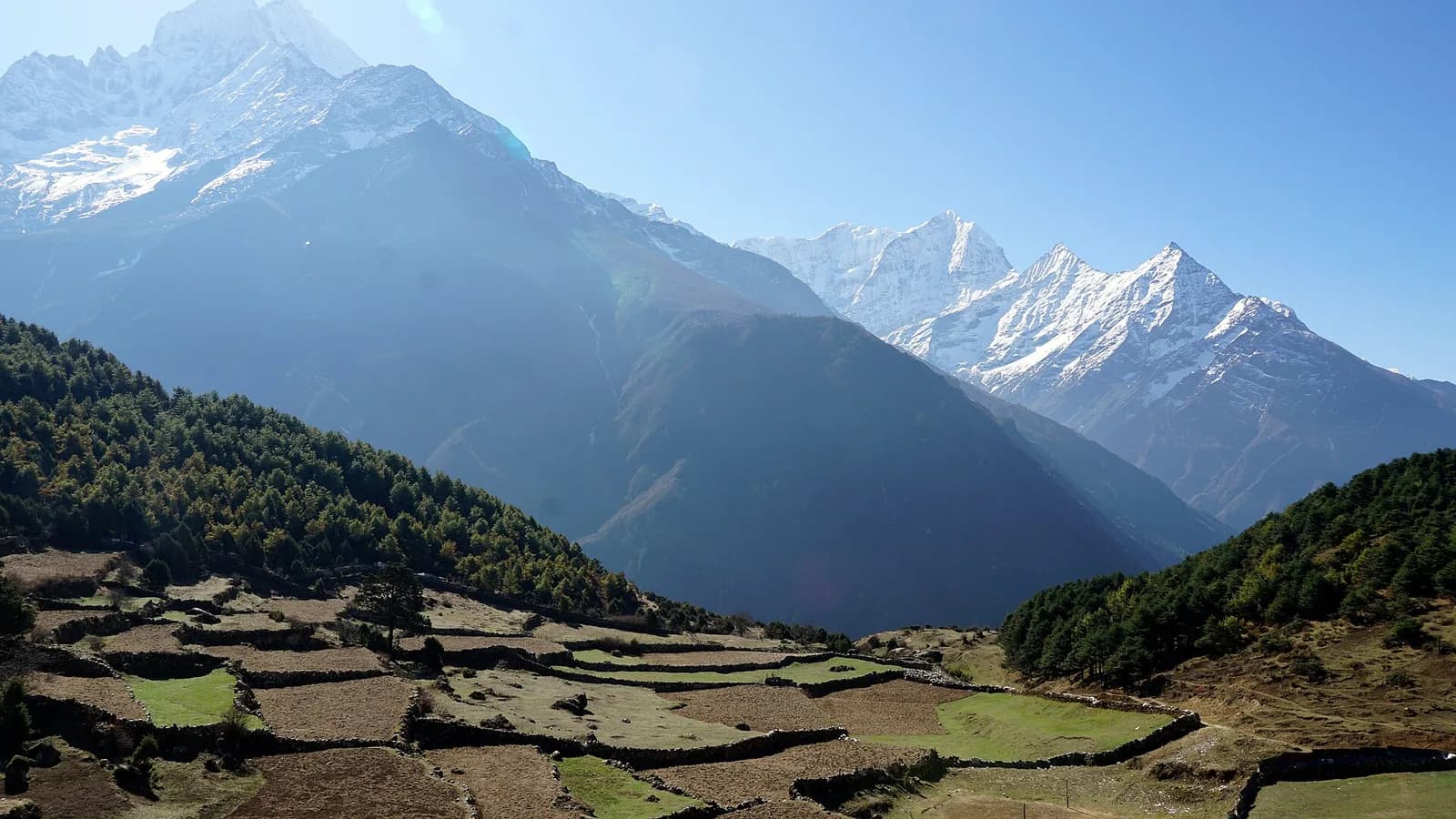 Snow-capped Himalayan peaks photographed from the air, the kind of panorama an Everest sightseeing flight delivers