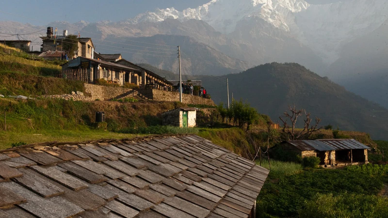 Annapurna South towering over the terraced fields and stone houses of Ghandruk village