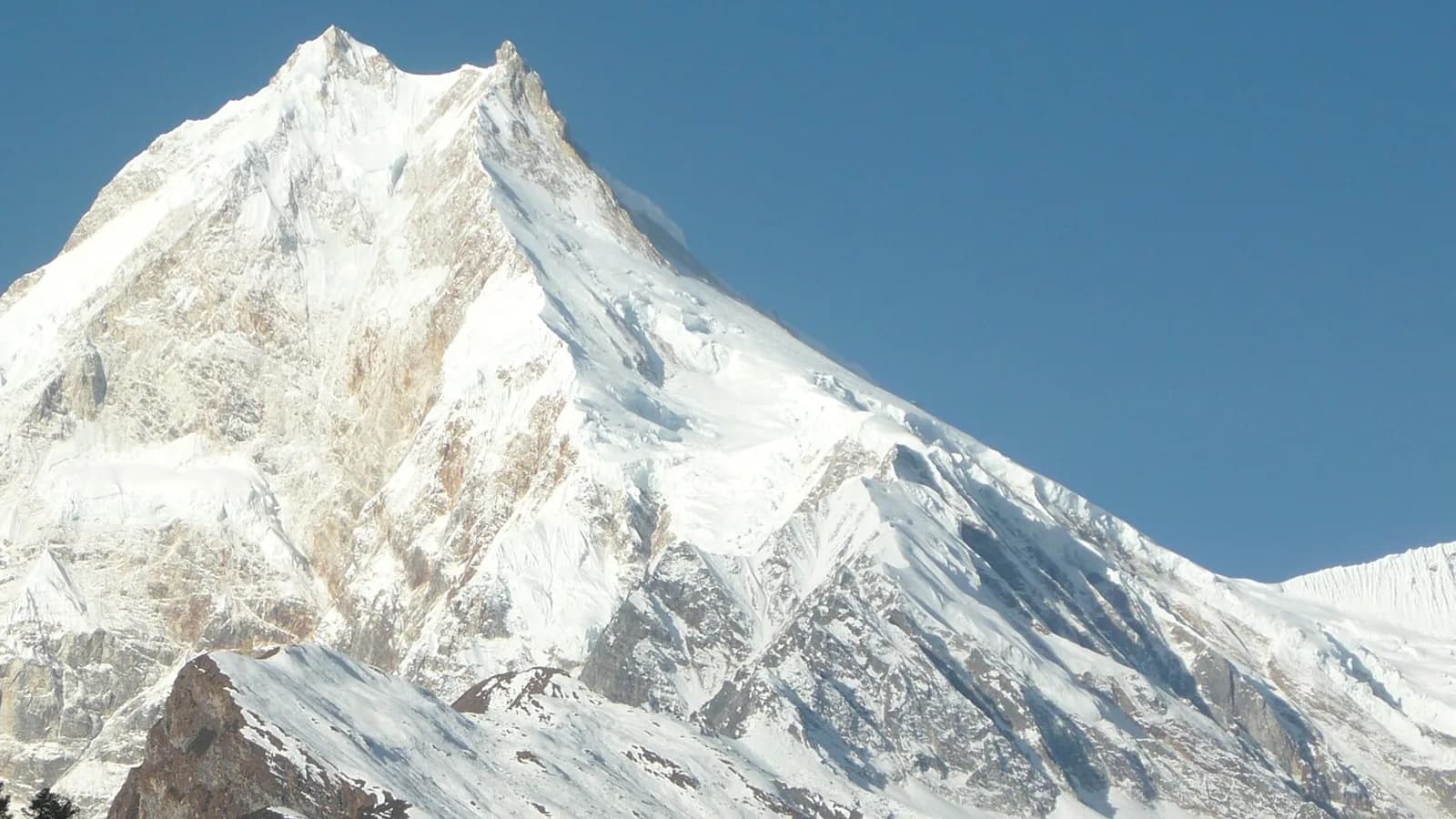 Glacier and snow peaks in Nepal's high Khumbu region under a clear sky
