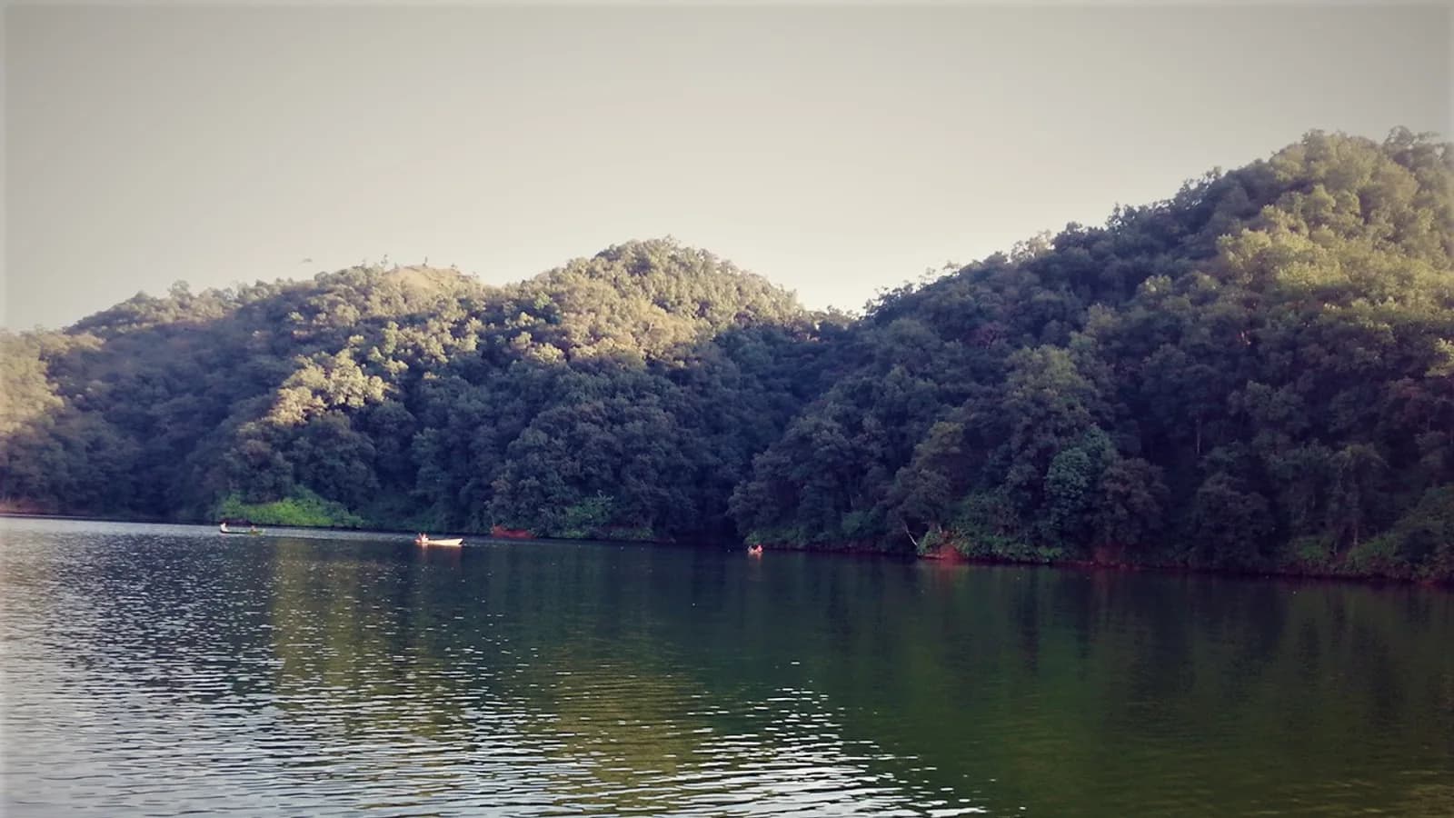 A green river valley in the Nepali hills, typical of the terraced, forested country the highway to Pokhara crosses