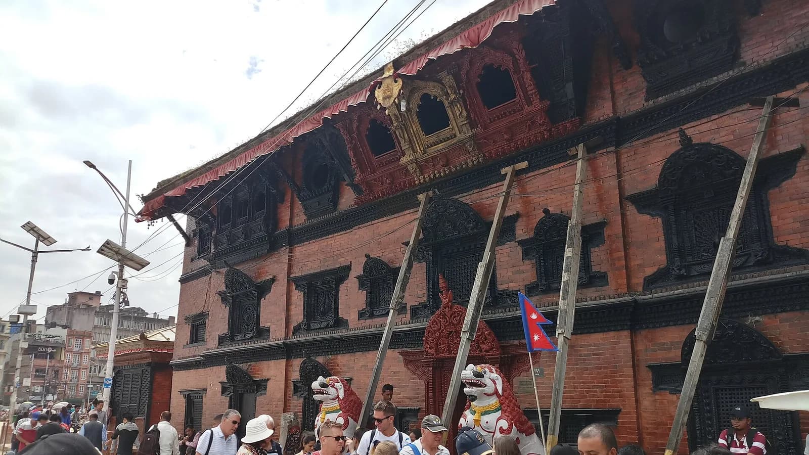 The intricately carved wooden facade of the Kumari Ghar, the residence of the living goddess, at Kathmandu Durbar Square