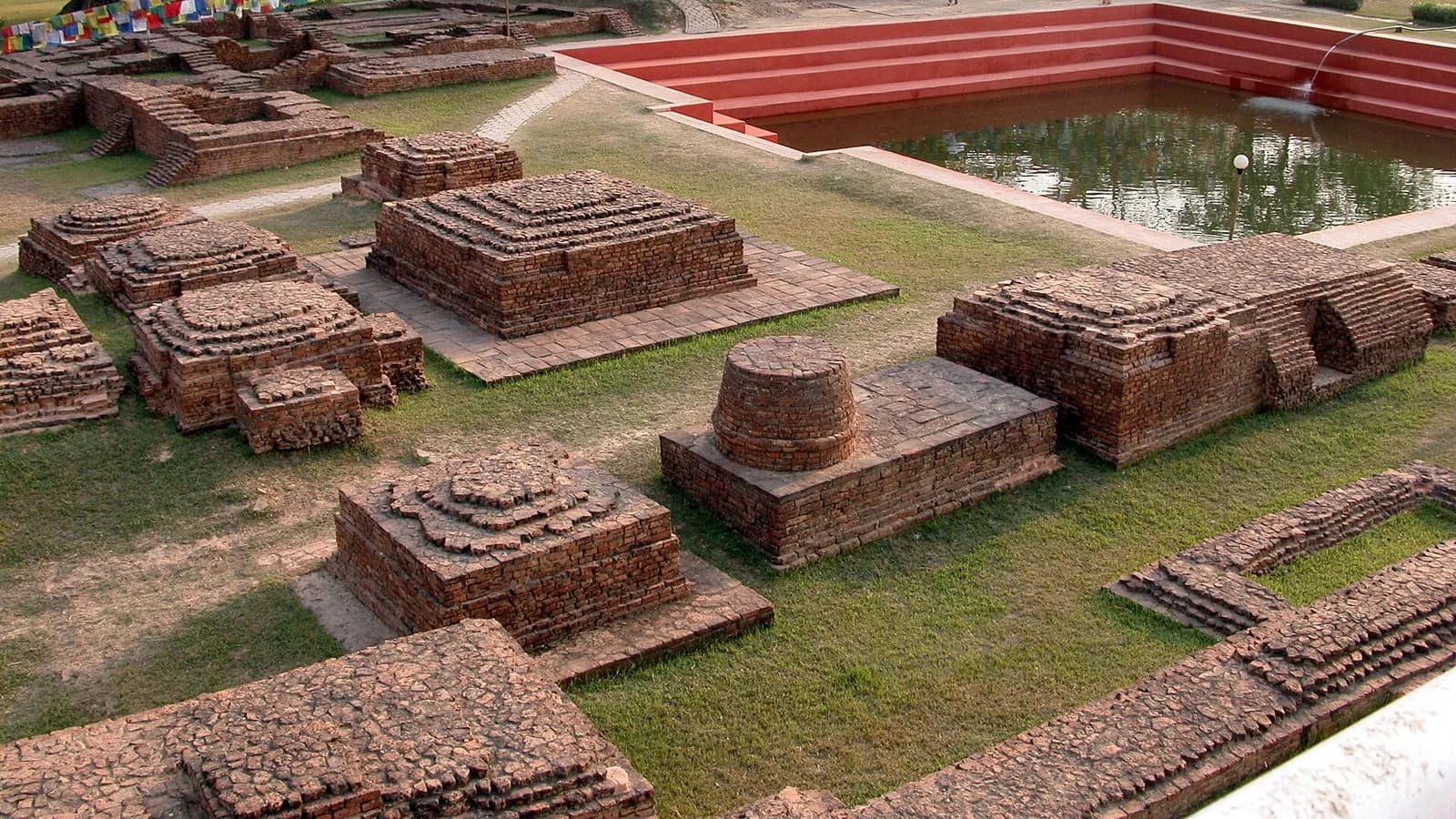 An ornate Buddhist monastery with golden roof detail in the Lumbini monastic zone, Nepal