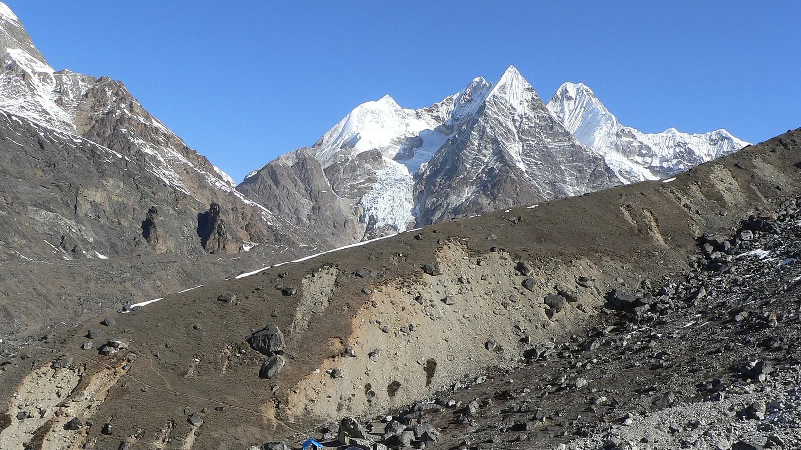 Snow peaks rising above the moraine near Mera Peak base camp in Nepal's Hinku Valley