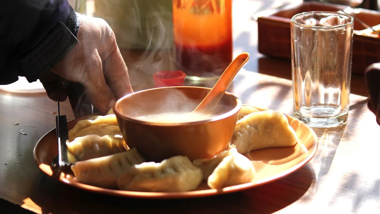 A plate of hot steamed momo dumplings