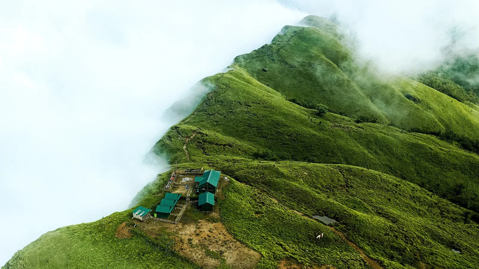 Misty fog and lush green hills at Khumai in the Annapurna region during the monsoon