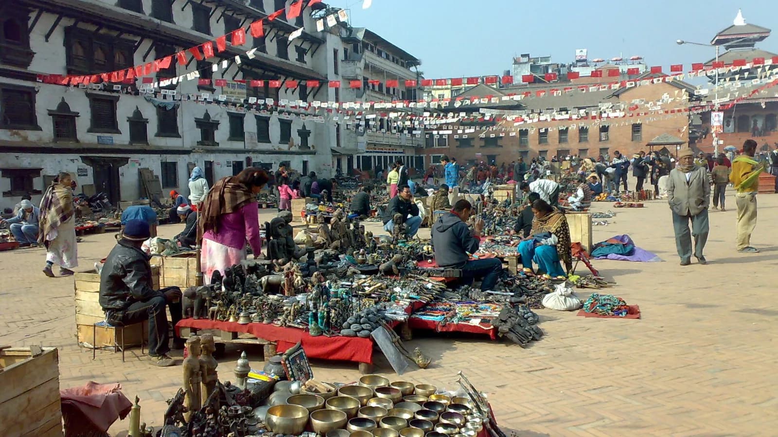 A busy Nepali market square of the kind where handicrafts and souvenirs are sold