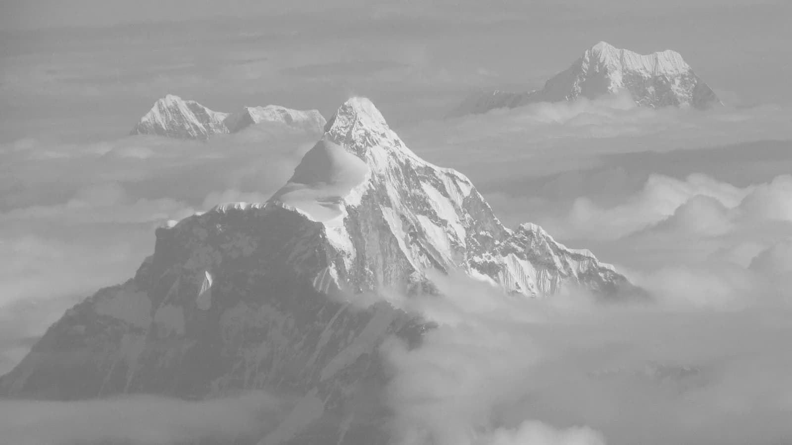 Snow-capped Gaurishankar mountain rising above clouds, the peak Nepal's standard time meridian passes through