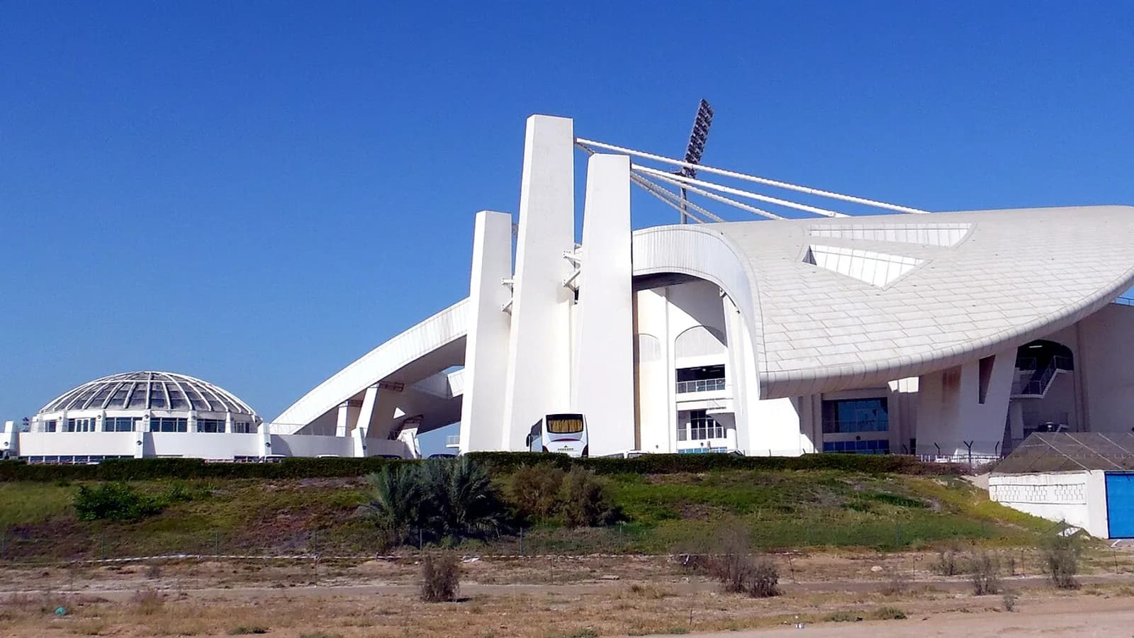 The white sculpted exterior of Sheikh Zayed Cricket Stadium in Abu Dhabi, a regular venue for UAE cricket