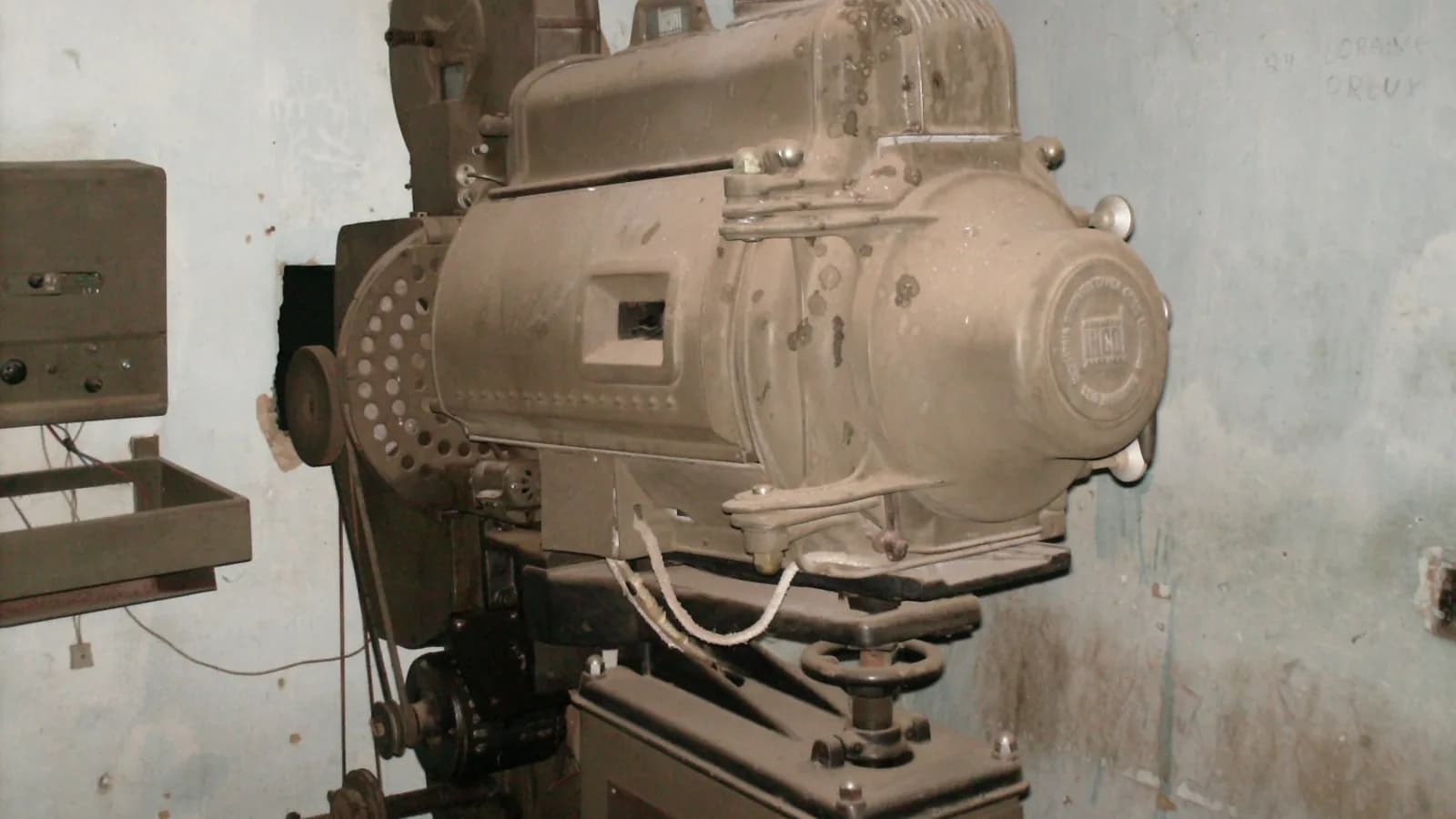 A vintage film projector of the kind once used to screen movies in cinema halls