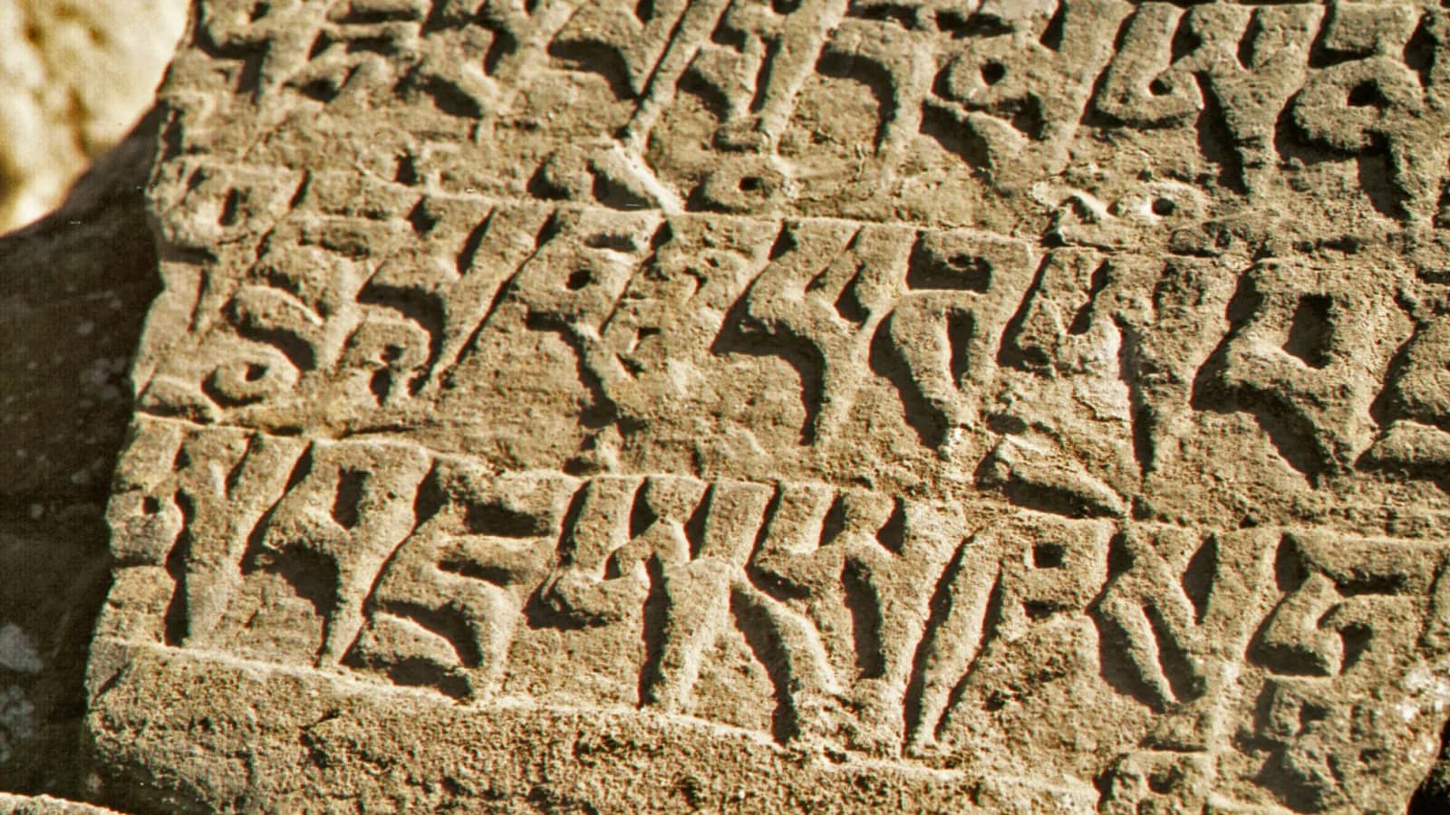 Buddhist mantras carved into mani stones along a trekking trail in the Khumbu region of Nepal