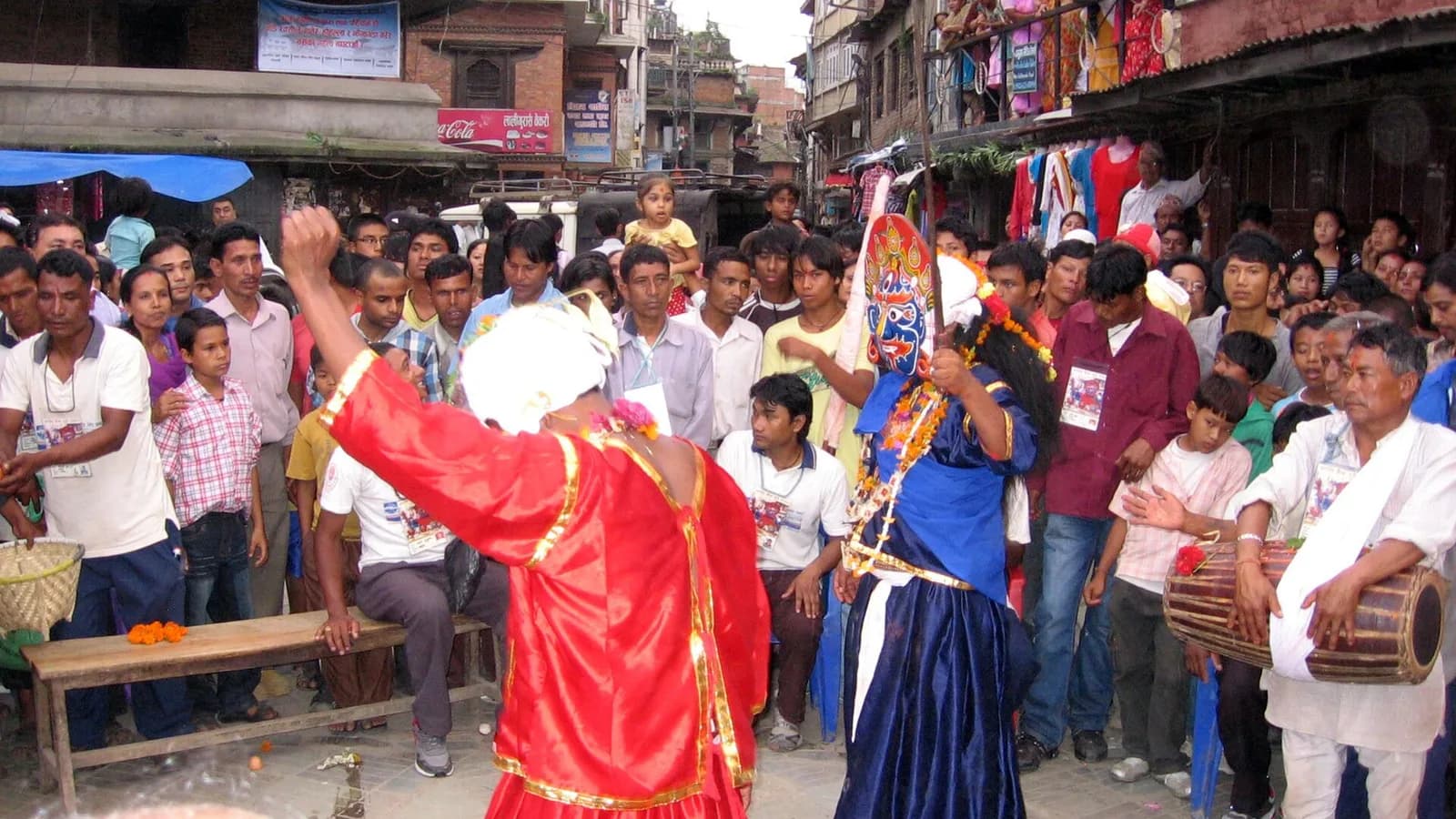 Masked Sawah Bhakku dancers, the blue Bhairav and red attendants, performing during the Indra Jatra (Yenya) festival in Kathmandu