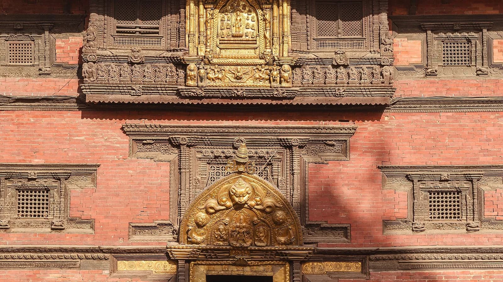 The cluster of stone and pagoda temples on the brick-paved plaza of Patan Durbar Square in Lalitpur, Nepal