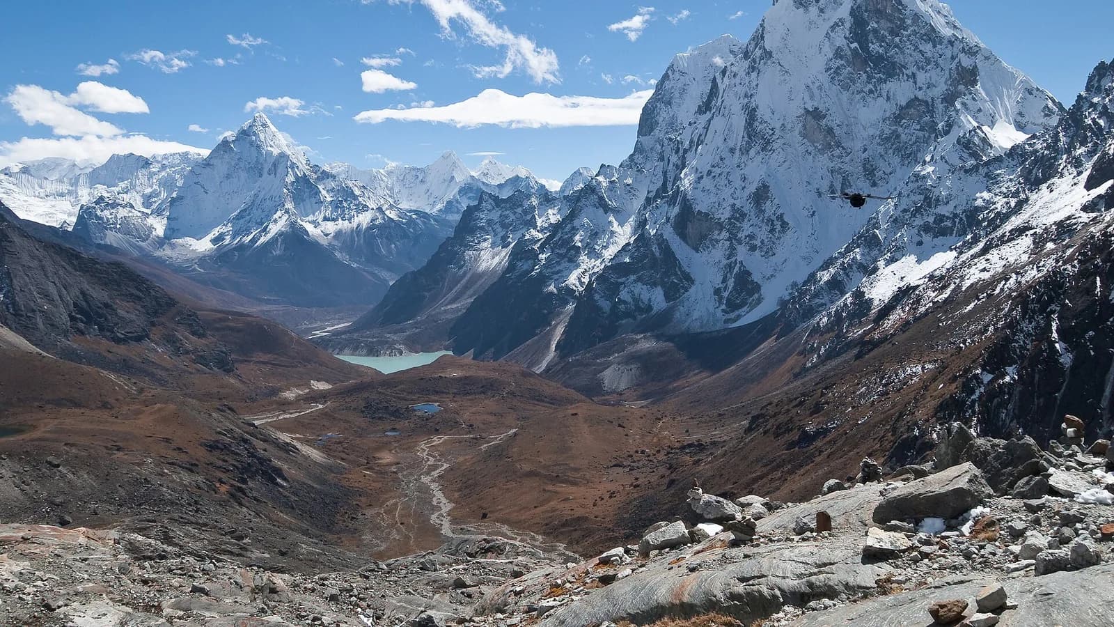 Snow-capped Himalayan peaks above a glacial valley in Nepal's Khumbu region, the kind of trekking peak that needs an NMA climbing permit