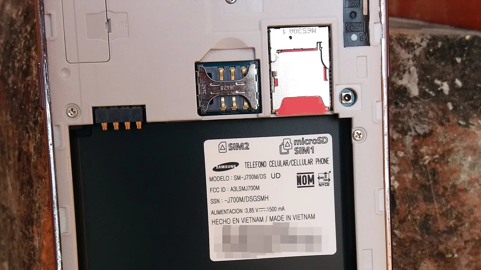 Back of a smartphone showing the SIM card slot, ready for a Nepal tourist SIM