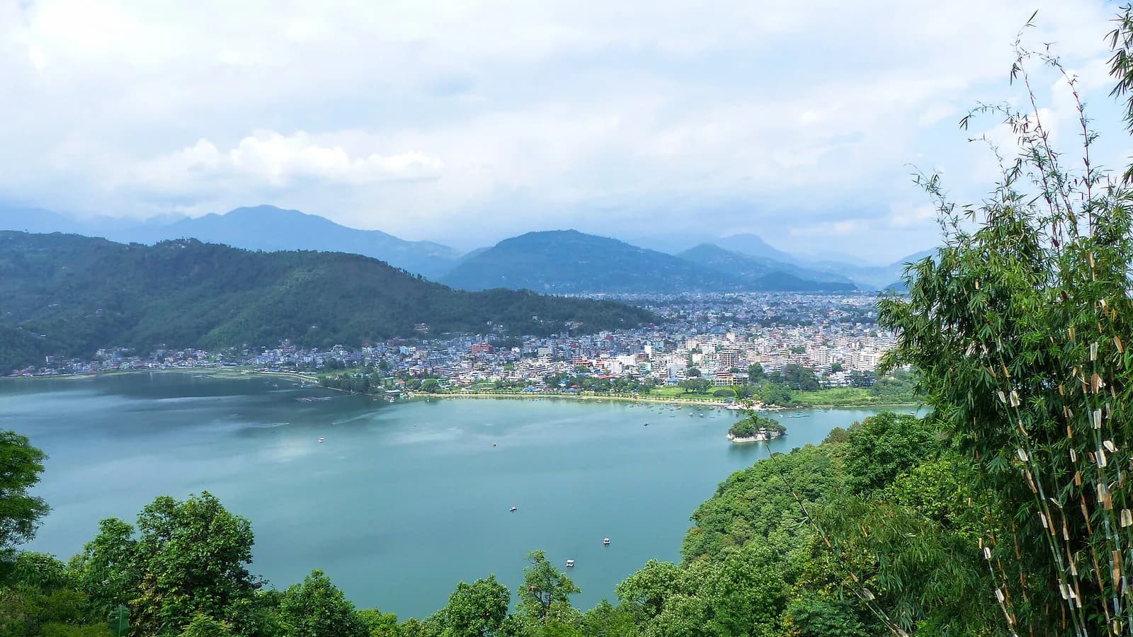 Sunset over Phewa Lake in Pokhara with hills in the background