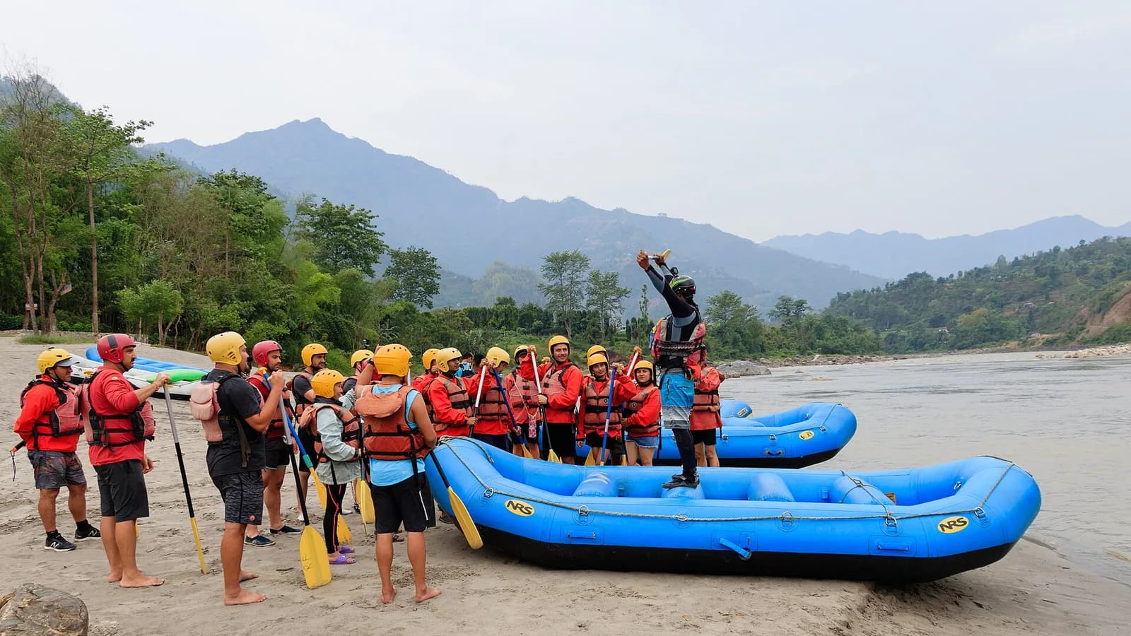 A safety briefing beside a raft on the banks of the Trishuli River in Nepal