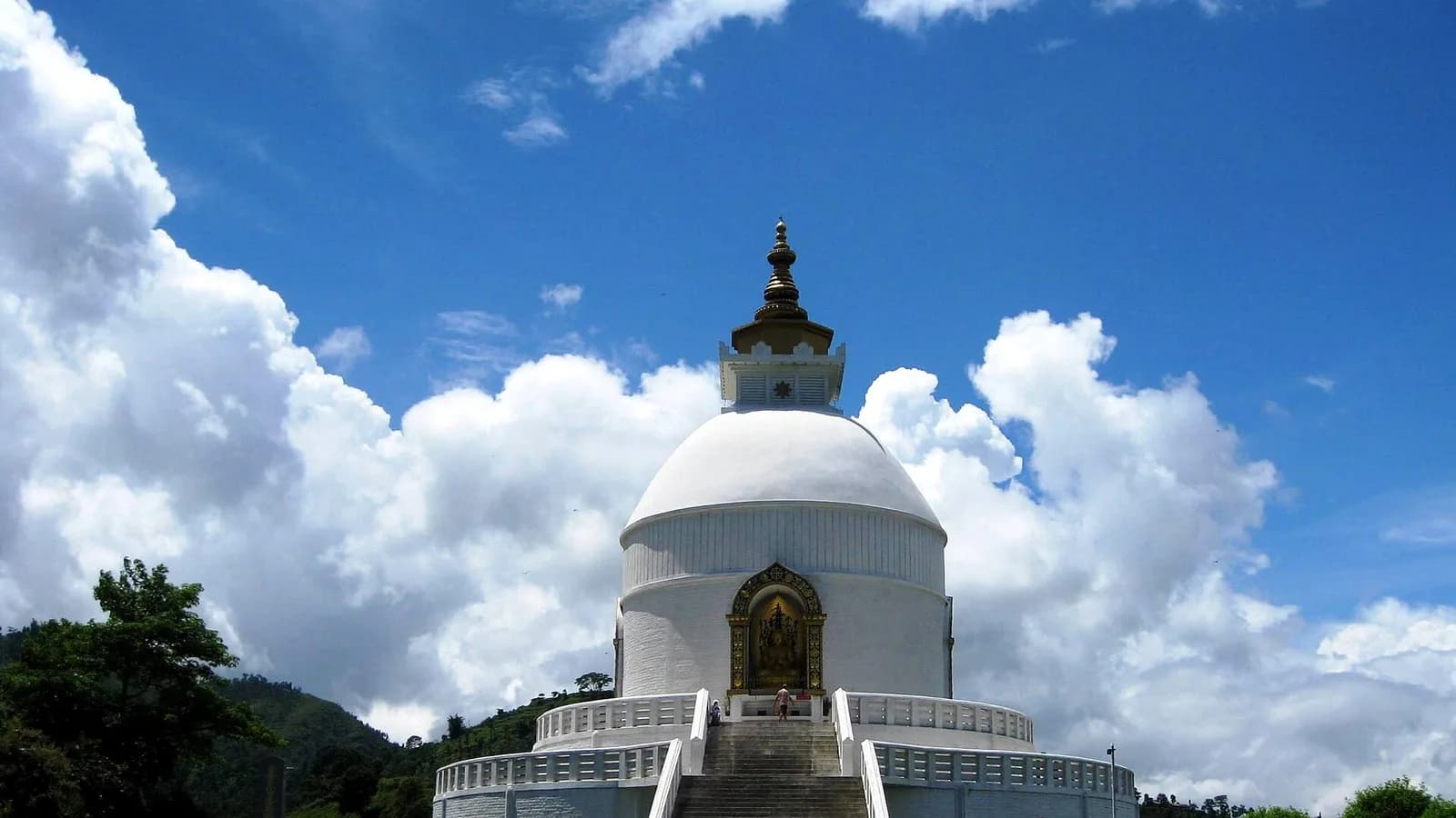 The white World Peace Pagoda stupa on a hilltop above Pokhara